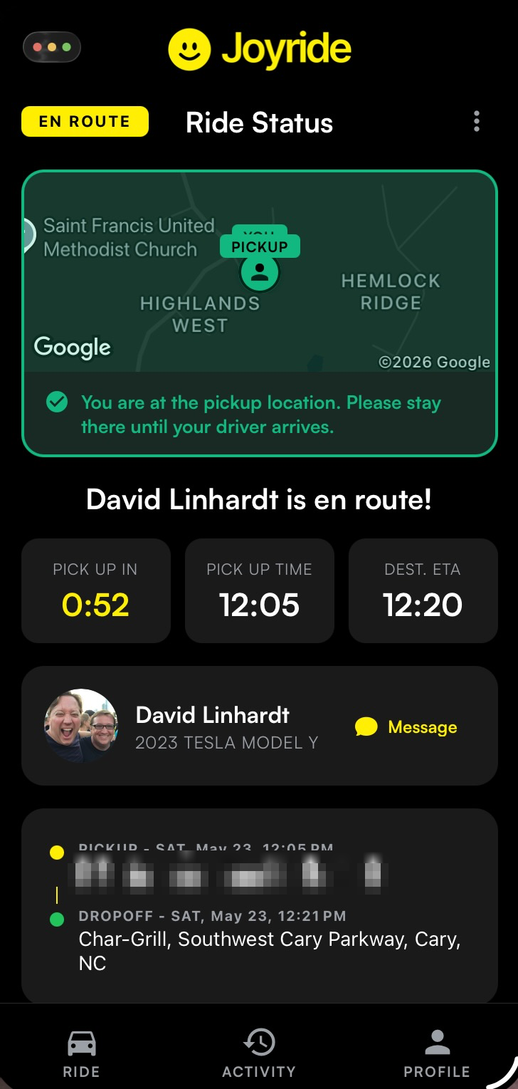 Joyride app showing the assigned driver en route to pickup with a live map and ETA